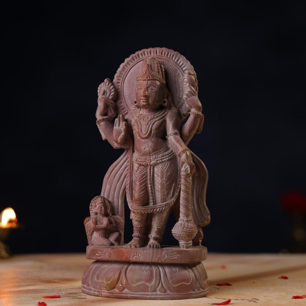 Side profile of handcrafted 8 inch Pink Stone Lord Vishnu idol statue