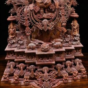 Close-up facial detailing of pink stone Ganesh murti