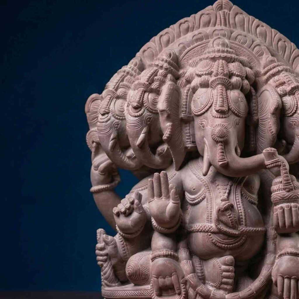 Front view of 8 inch pink stone Panchmukhi Ganesh statue showing five-faced design and detailed carving