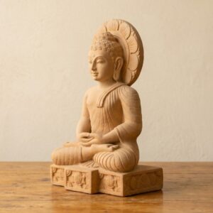 A serene pose captures the Sandstone Buddha Statue, showcasing intricate details and a calming presence.