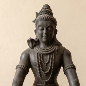 The Black Stone Shiva Statue showcases intricate detailing in the jewelry and serene expression.