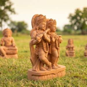 Intricately carved Sandstone Radha Krishna Idol showcases the divine couple in a joyful pose, surrounded by nature.