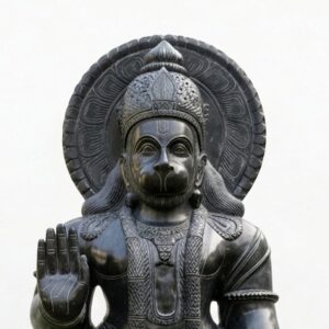 Intricate detailing on the crown and a raised hand define this 6 Feet Black Stone Standing Hanuman Idol.