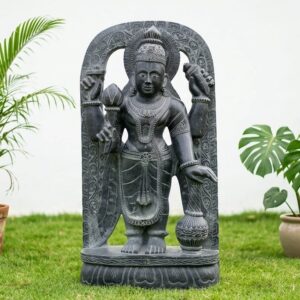 Front view of a detailed black stone figure holding items, 60 Inch Black Stone Vishnu Idol – Handcrafted Lord Vishnu Murti.