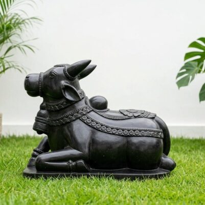 Front view of a lying black stone bull statue, 12 Inch Black Stone Nandi Idol.
