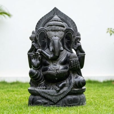 Front view of a black stone idol with intricate designs, featuring an 18 Inch Black Stone Ganesh Statue.