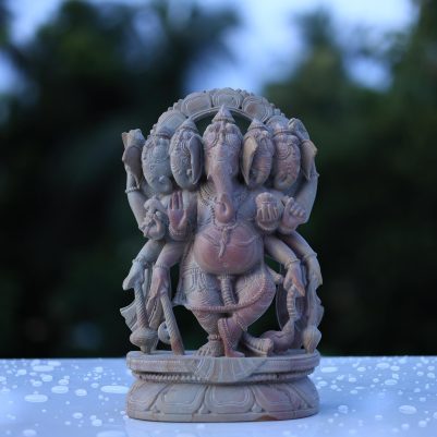 Handcrafted standing Panchmukhi Ganesh idol made from pink stone, 10 inches tall, featuring five faces and detailed carving for spiritual and home décor use.